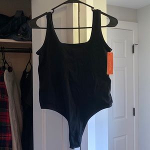 Brand new black ribbed bodysuit